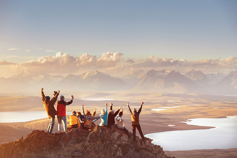 Large group of happy friends in mountains area Large group of happy friends in mountains area